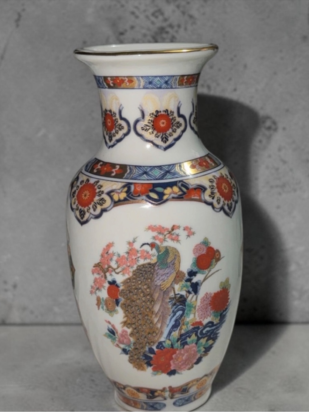 Classic White Porcelain Peacock Vase with Red and Blue Accents